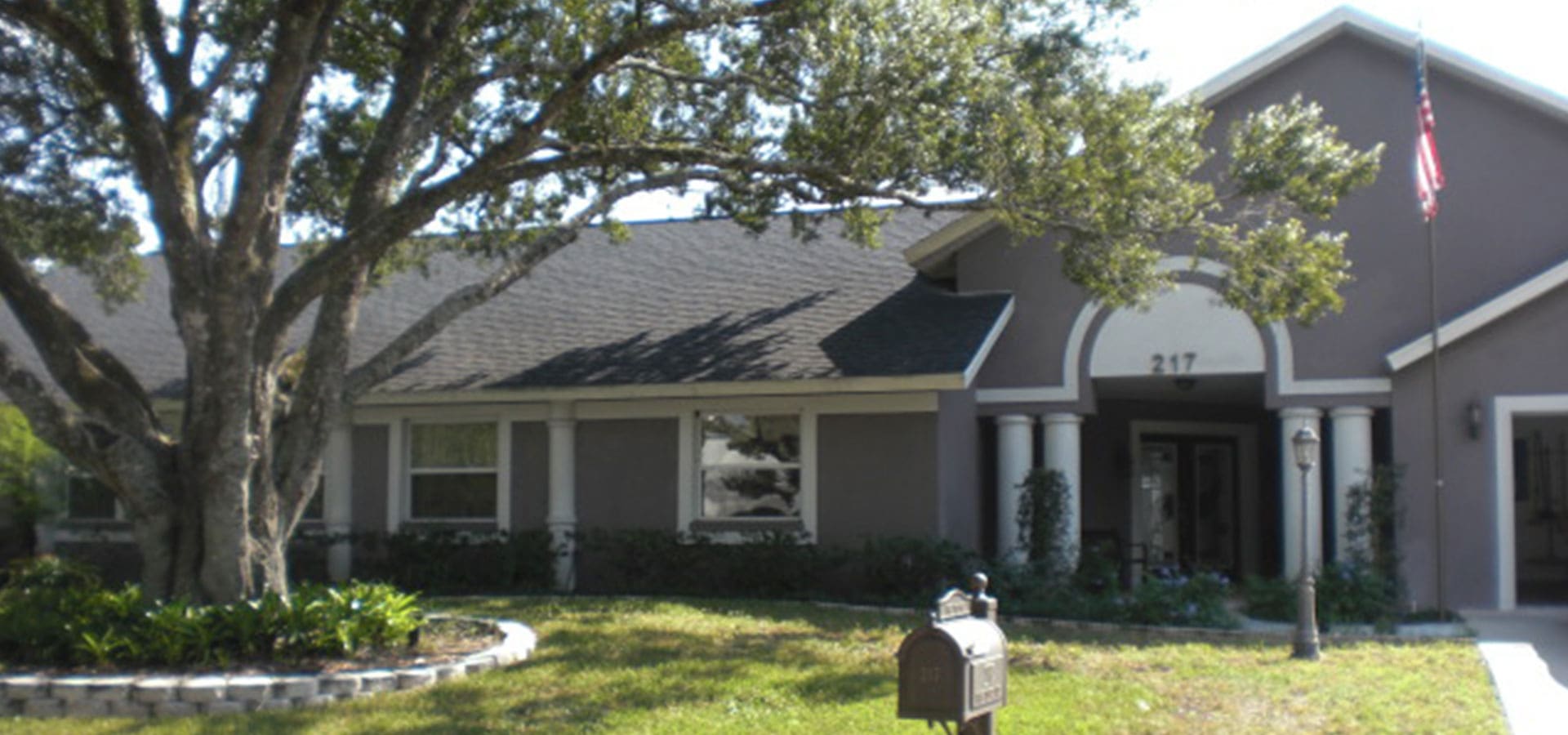 A house with a mailbox in front of it